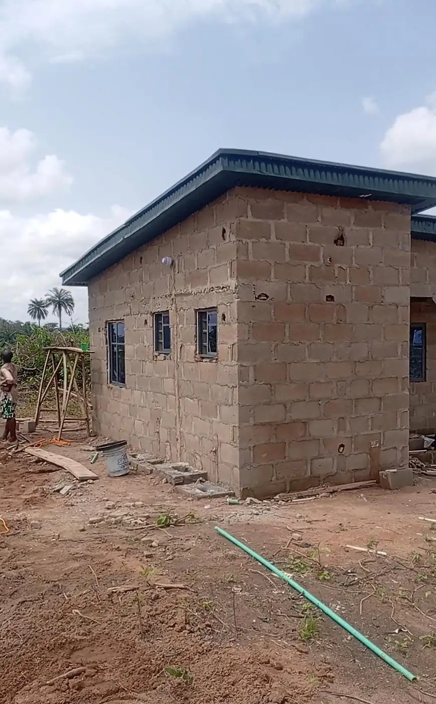 Roofed block building with window frames