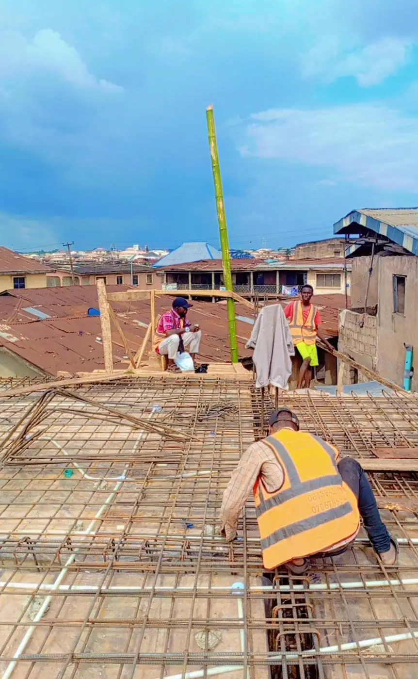 Crew fixing reinforcement ahead of the pour