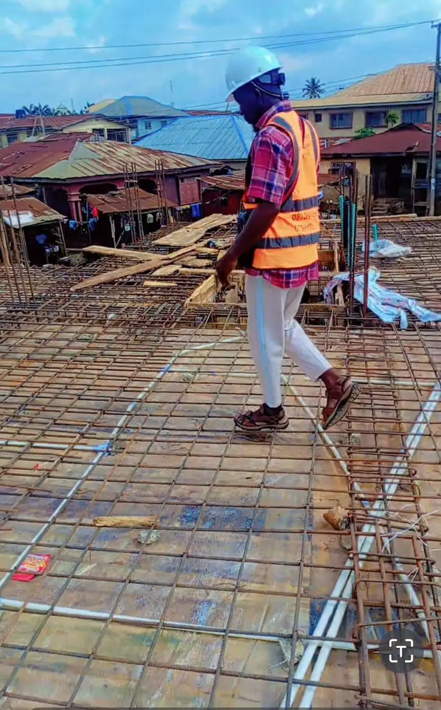 Supervisor checking slab reinforcement
