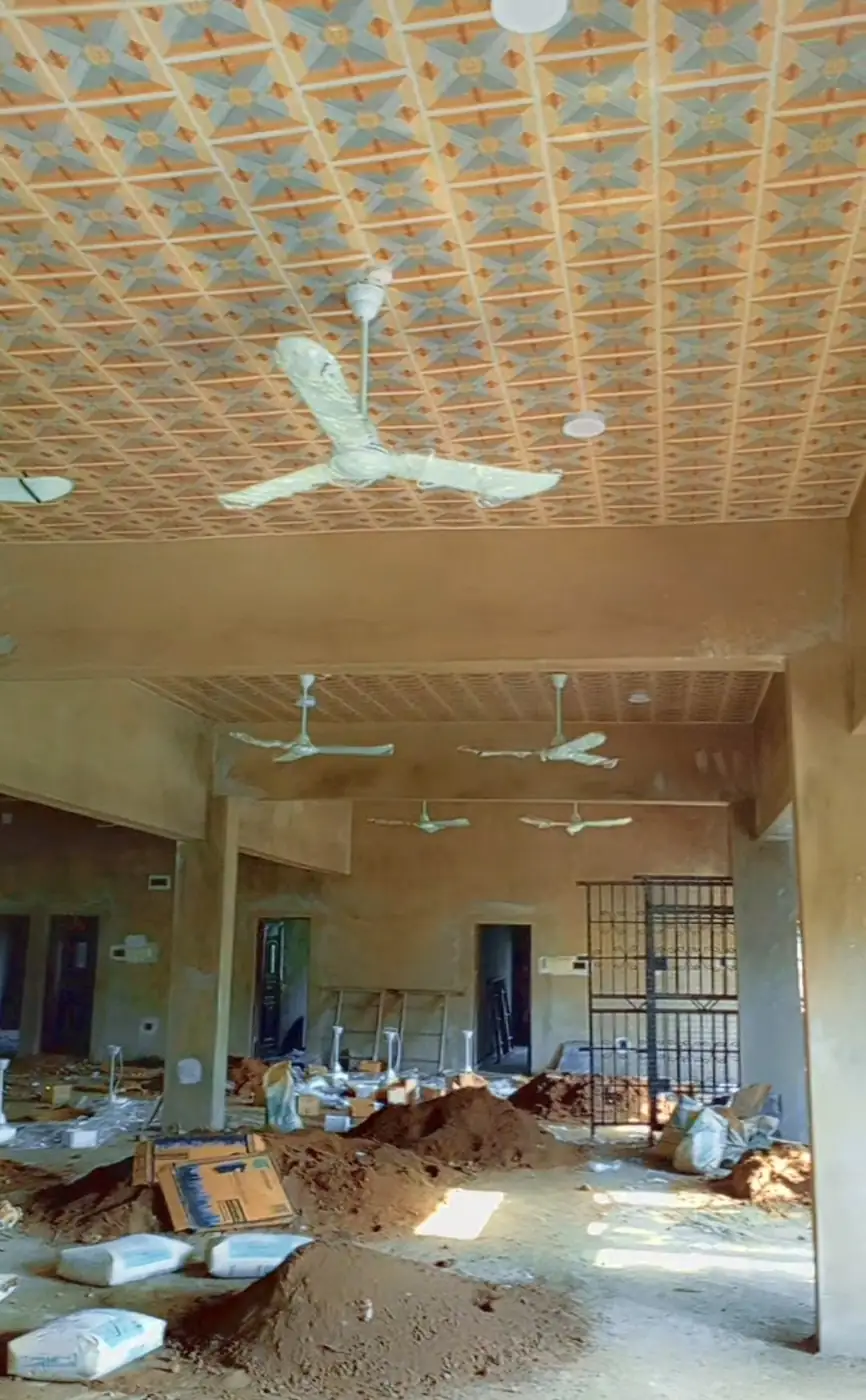 Large hall with ceiling fans fitted, before final clean-up