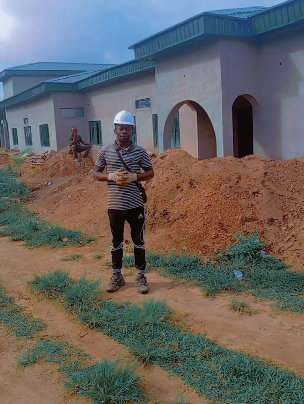 Site supervisor in hard hat at a bungalow site